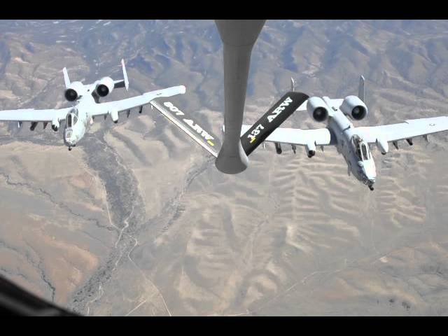 Two A-10 warthogs trail a KC 135 Stratotanker midair refueling