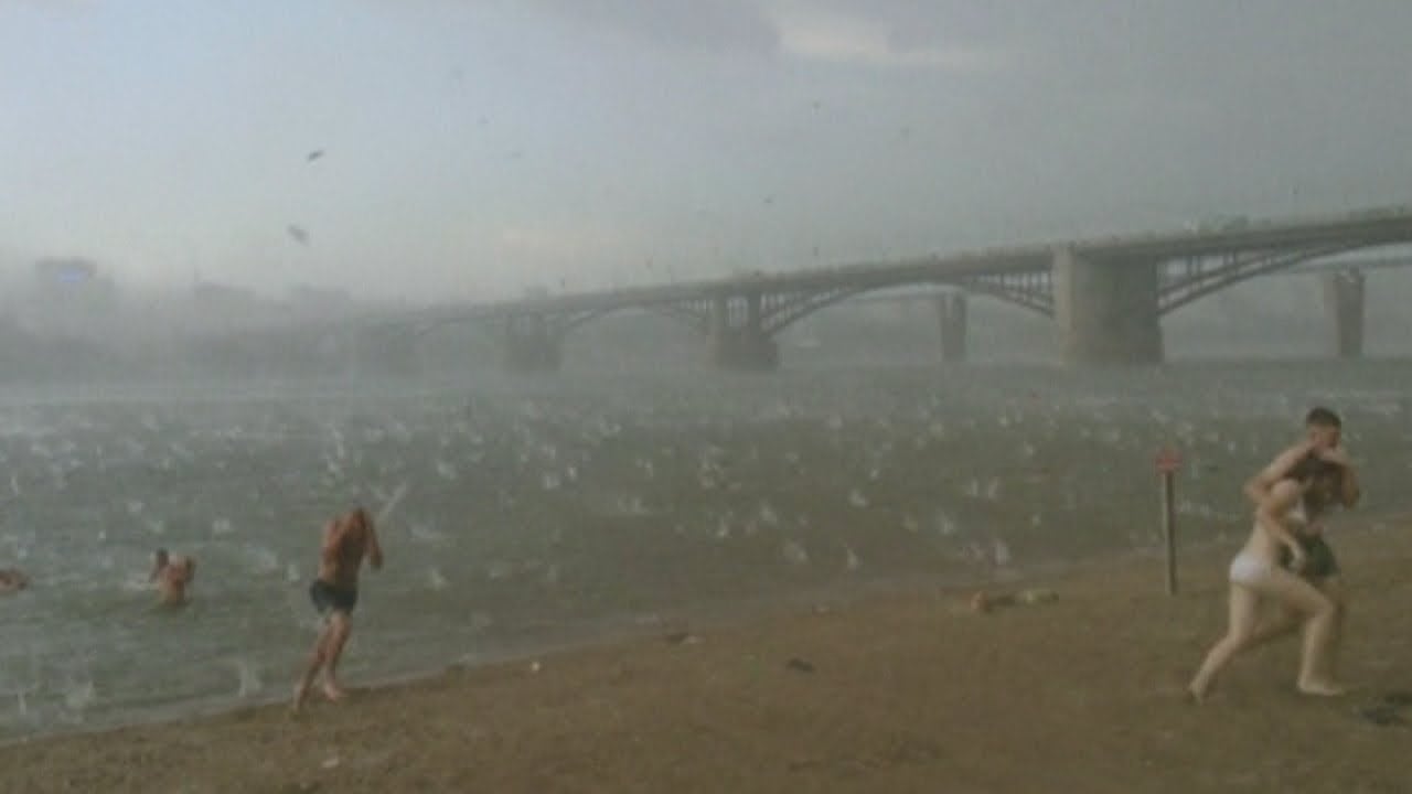 Dramatic storm: Freak Russian hailstorm sends beachgoers screaming on hot summer day