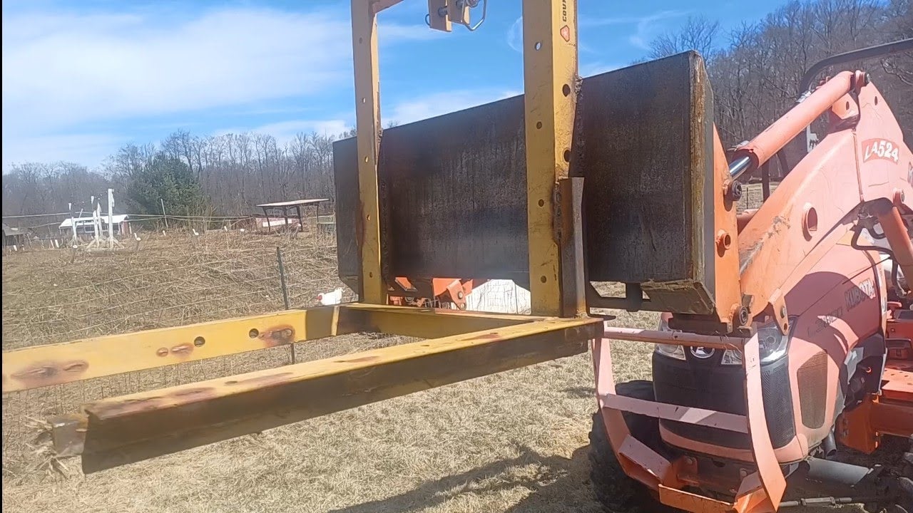 welding Country Line Carry-All into Log  Forks