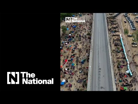 Drone footage shows over 10,000 people camped under Texas bridge