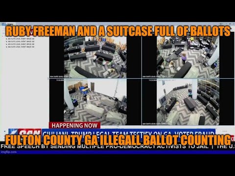 Ruby Freeman pulls out suitcases with fraudulent ballots.