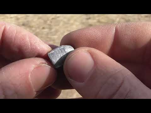 Examining Bullet from First Sabot Test (TIS319)