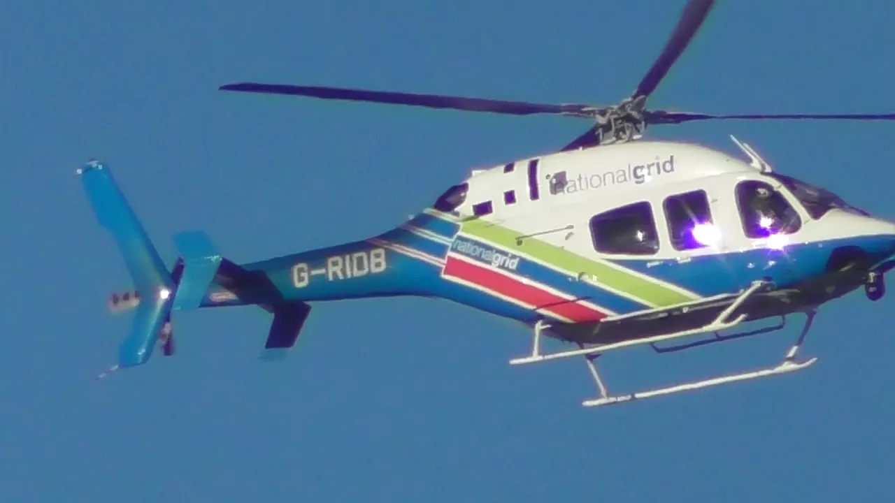 testing the zoom on a Panasonic hc w580 video camera HELICOPTER IN SKY