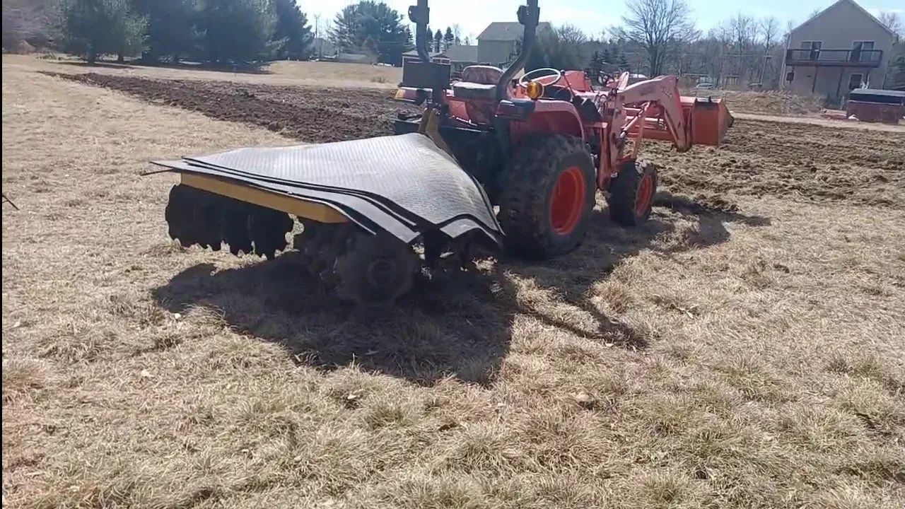 Weighing down a Disc Harrow with rubber mats - Kubota L3800 tractor