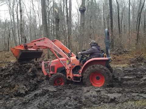 Kubota L3800 clearing out mud