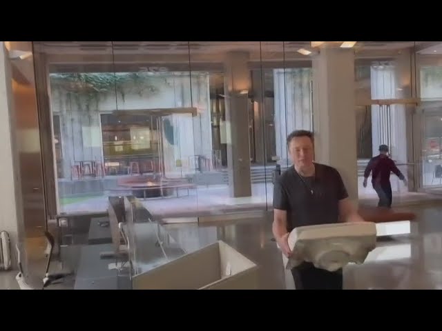 Smiling Elon Musk strolls into Twitter's San Francisco headquarters