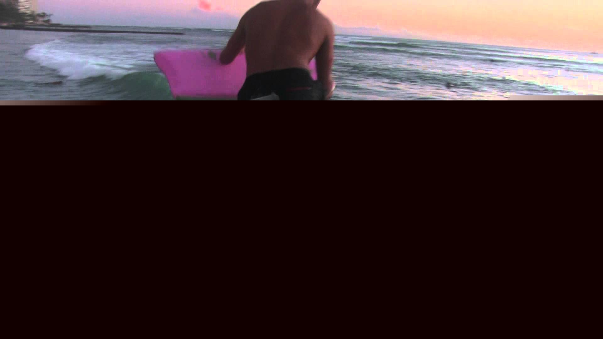Guy Jumps into Wave Waikiki Hawaii