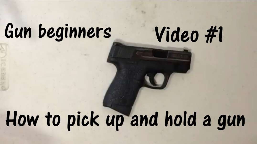How to safely pick up and hold a gun.mp4