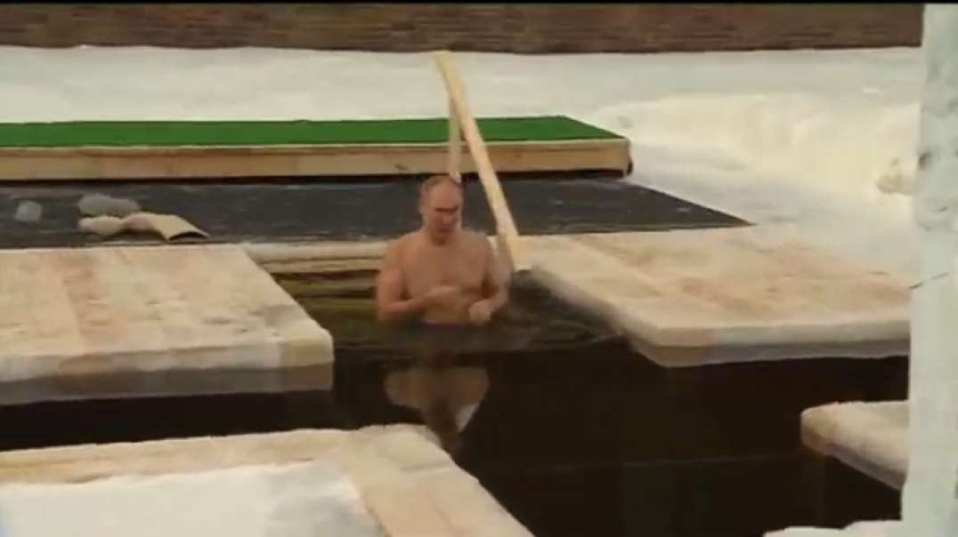 Putin takes traditional Epiphany dip in icy waters