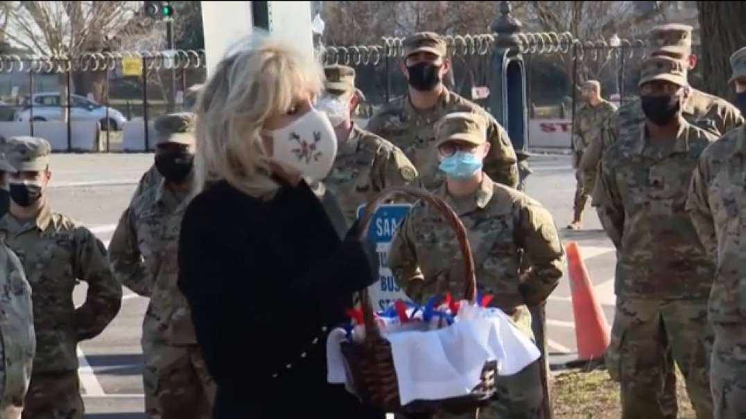 First Lady hits the road in D.C.:Offering cookies of thanks to National Guard to visiting HIV clinic