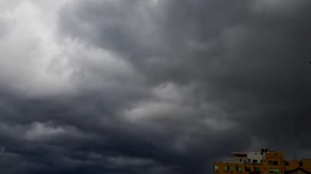 Huge black clouds cover the sky of Gaza City, Palestine
