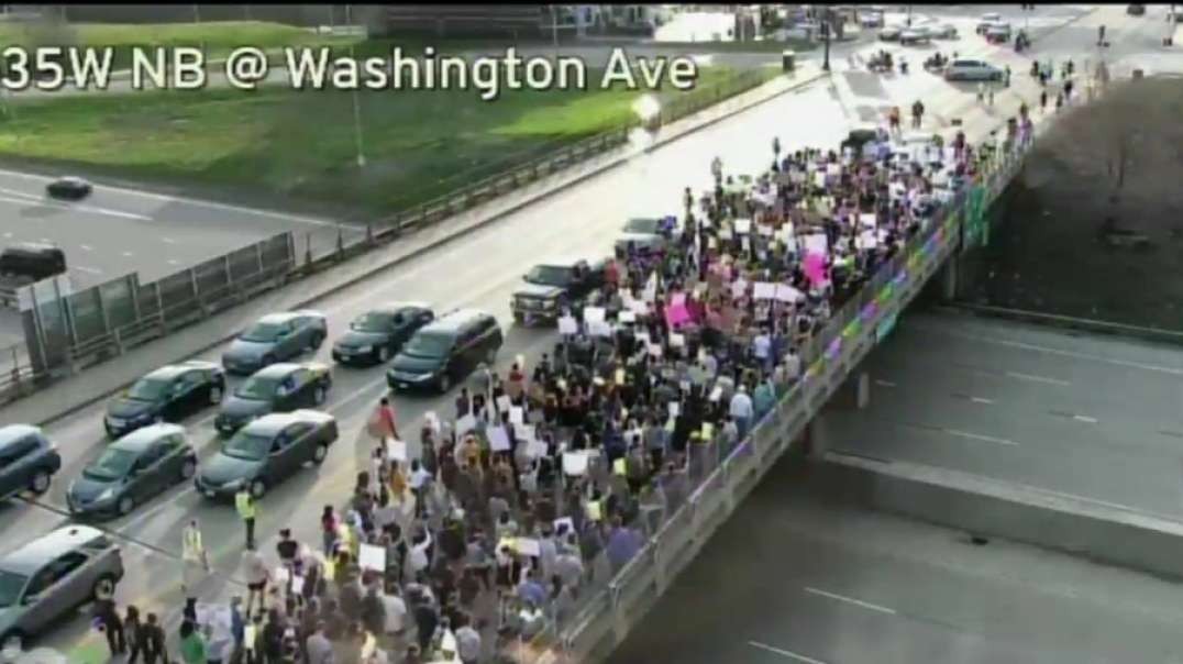 Minneapolis, Minnesota, Happening Now: pro abortion activists are marching across the Washington Avenue bridge over 35W in Minneapolis.