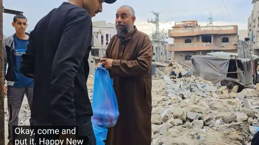 Rafah Gaza Distributing Food Donations To Displaced Living Amongst Destroyed Buildings.mp4