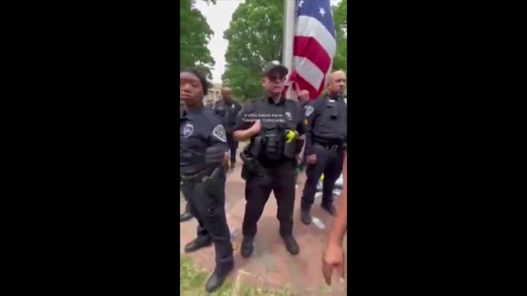 American police spits on the Palestinian flag yes of course trained in Israel