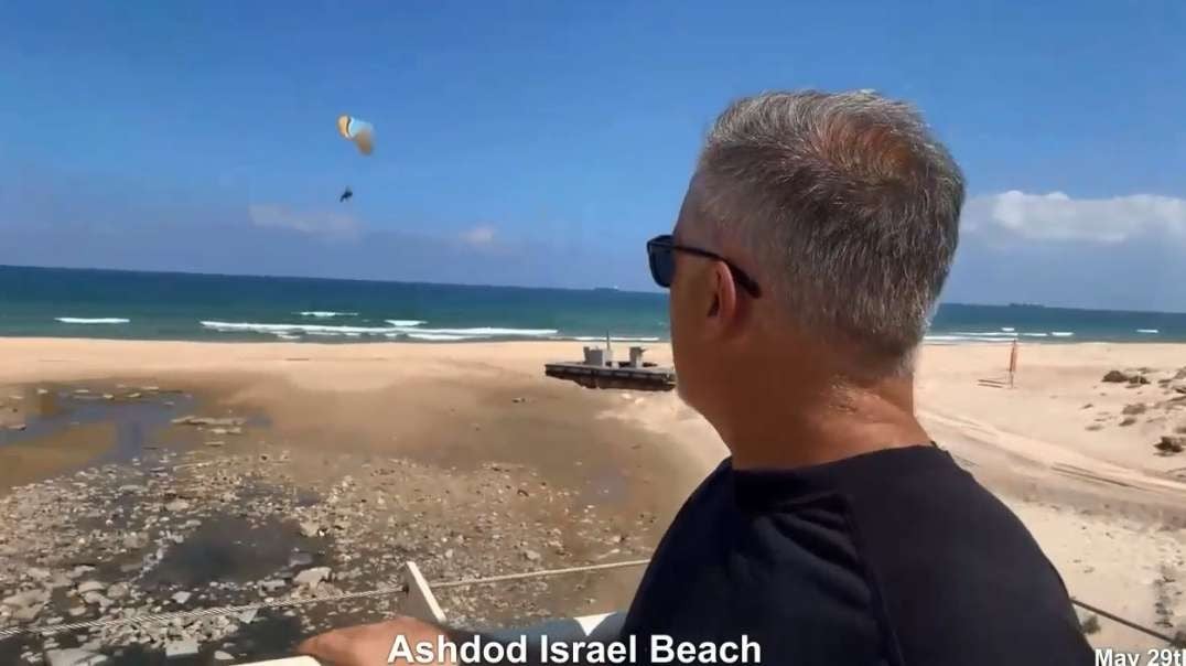 Practicing Hamas Paraglider Flying in Israel for Hasbara Propaganda Near Pier Break-off Ashdod beach