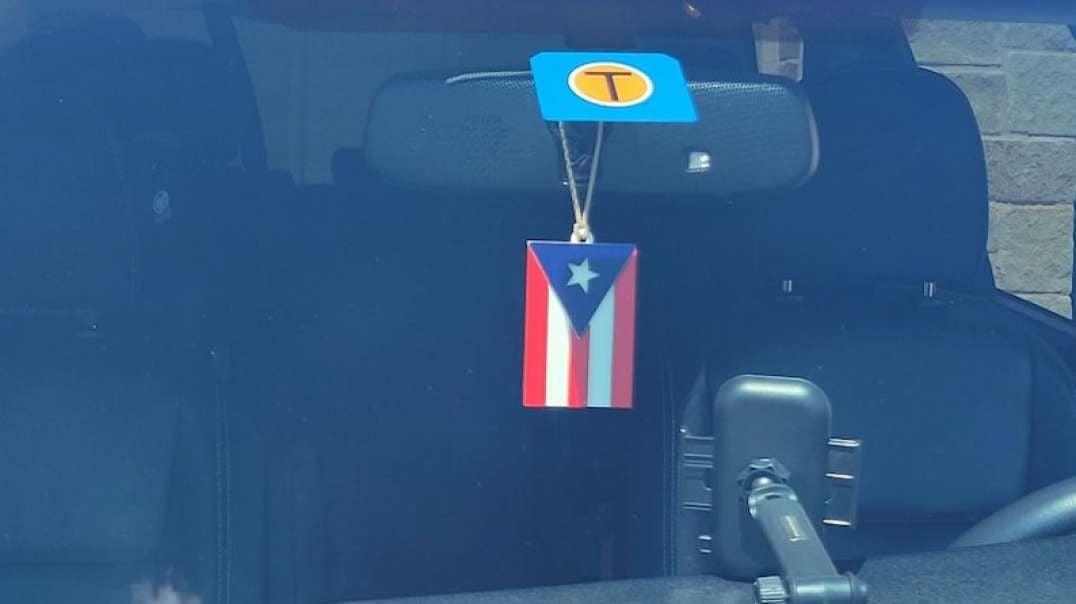 Criminal invading puerto ricans profiteer of flags illegally obstructing the view of driving!